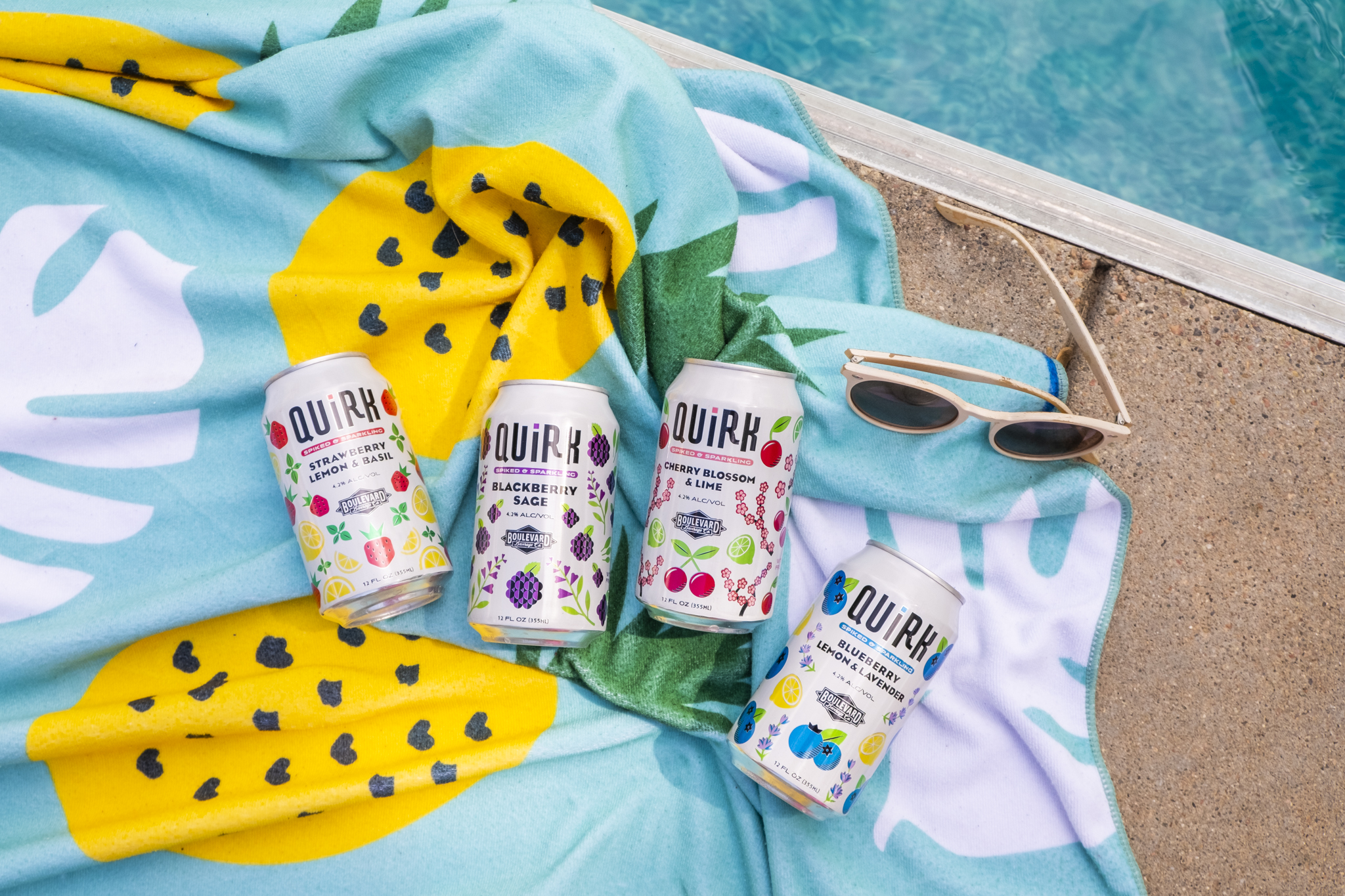 12oz Quirk Cans on Beach Towel