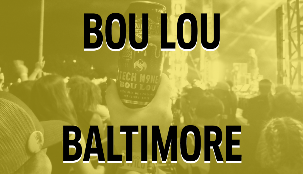 A sepia-toned image of a handheld can with the text "Tech N9ne Bou Lou" against a backdrop of a stage and audience. The words "Bou Lou Baltimore" are prominently displayed over the image.