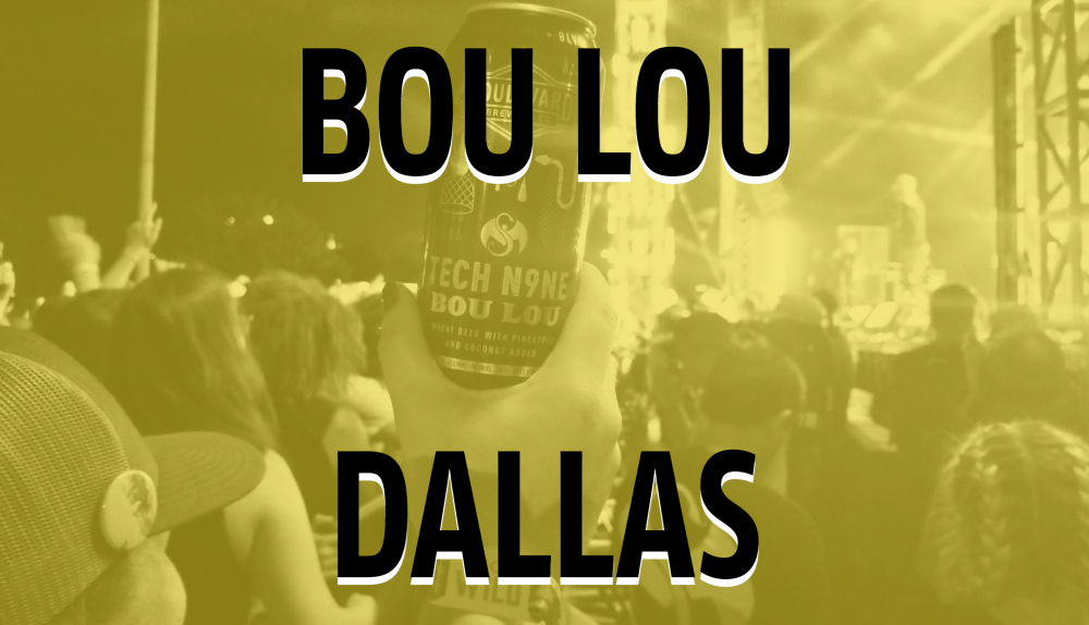 A person holding a can of Bou Lou beverage at a concert in Dallas. The scene is illuminated with stage lights in the background, and the crowd is enjoying the live performance.