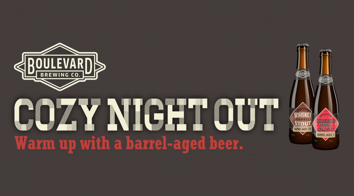 Boulevard Brewing Co. advertisement with two bottles of beer labeled "Whiskey Barrel Stout" and "Bourbon Barrel Quad." Text reads: "Cozy Night Out. Warm up with a barrel-aged beer." Brown background.