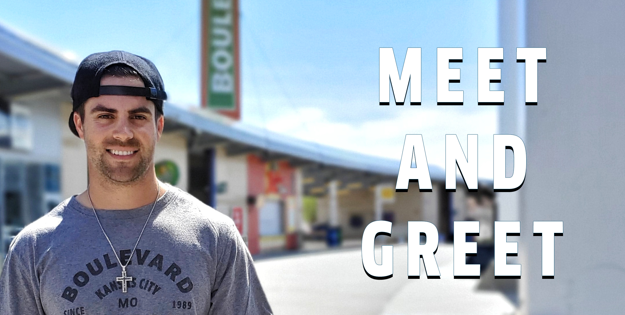 A person wearing a gray "Boulevard Kansas City MO" shirt and a cross necklace smiles outdoors near a building. The text "Meet and Greet" is prominently displayed on the right side of the image.