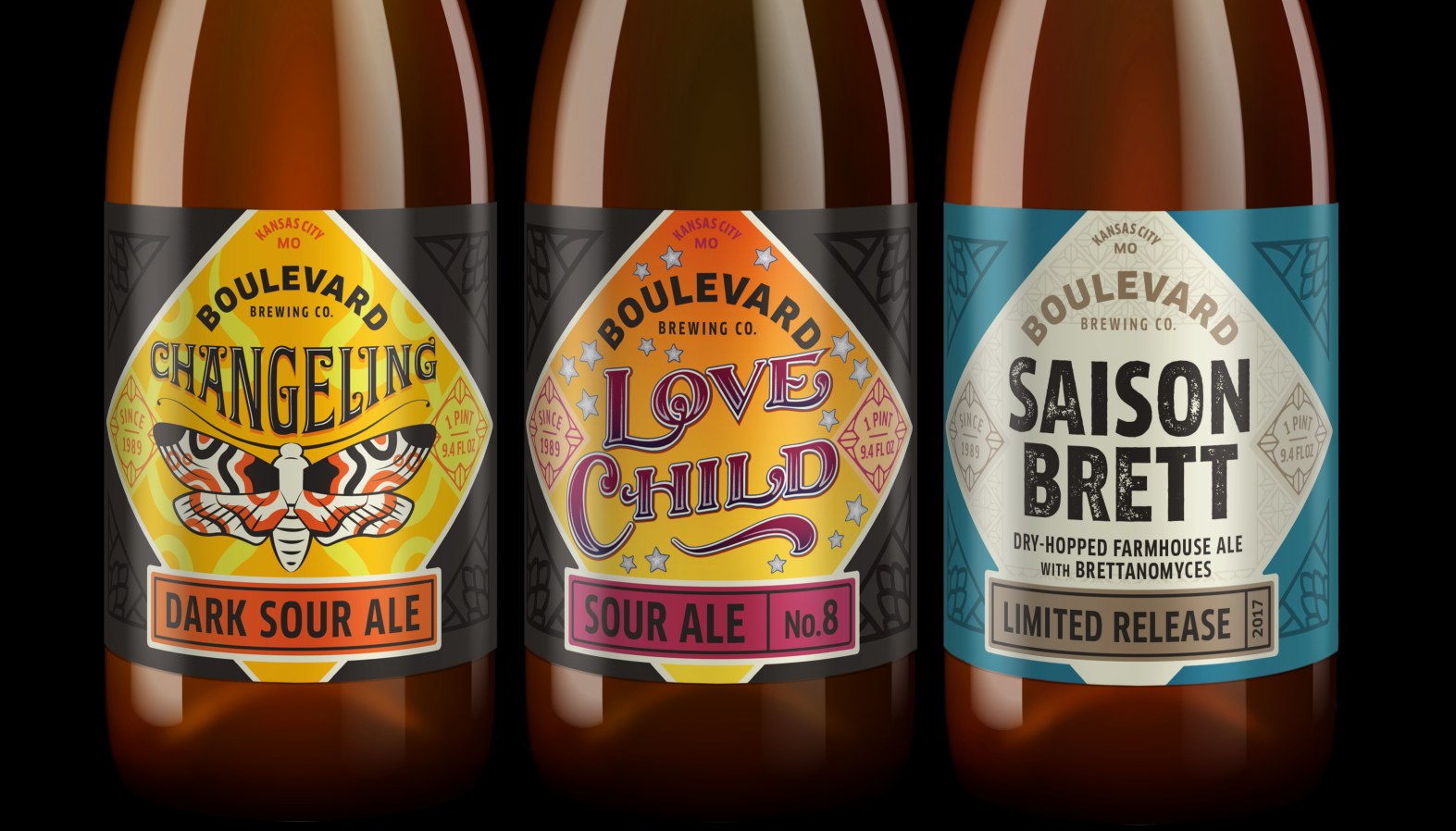 Three Boulevard Brewing Co. beer bottles are displayed side by side. The labels read: "Changeling Dark Sour Ale," "Love Child No. 8 Sour Ale," and "Saison Brett Limited Release Dry-Hopped Farmhouse Ale with Brettanomyces.