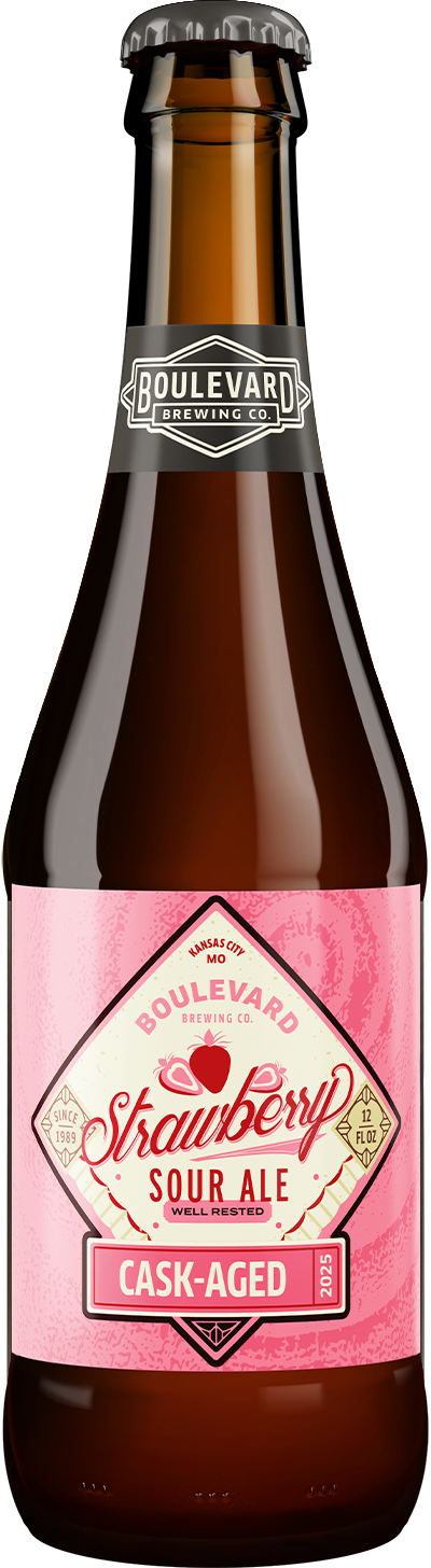 A brown glass bottle of Boulevard Brewing Co. Strawberry Sour Ale, featuring a pink label with red and white text reading "Strawberry Sour Ale Cask-Aged" and a black neck label with the brewery's logo.