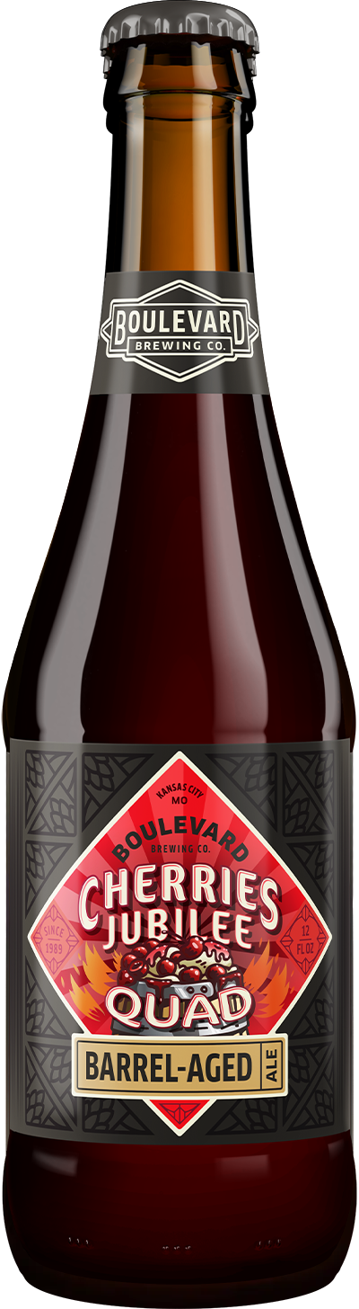 A brown glass bottle of Boulevard Brewing Co.'s Cherries Jubilee Quad Barrel-Aged Ale, featuring a red, black, and gold label with geometric patterns and bold text.