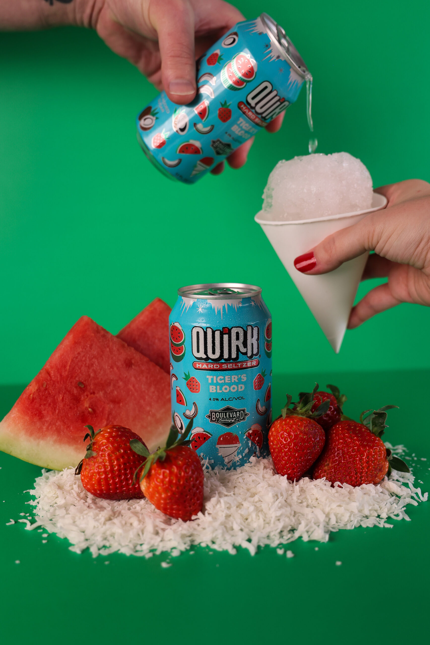 A hand pouring ice into a can of soda.