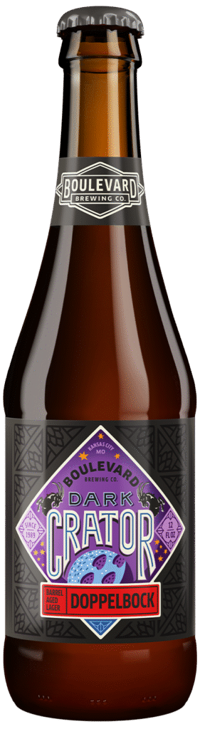 A brown glass beer bottle with a black cap, featuring a purple, diamond-shaped label reading "Dark Crator Doppelbock" from Boulevard Brewing Co. The label includes moon and crater graphics.