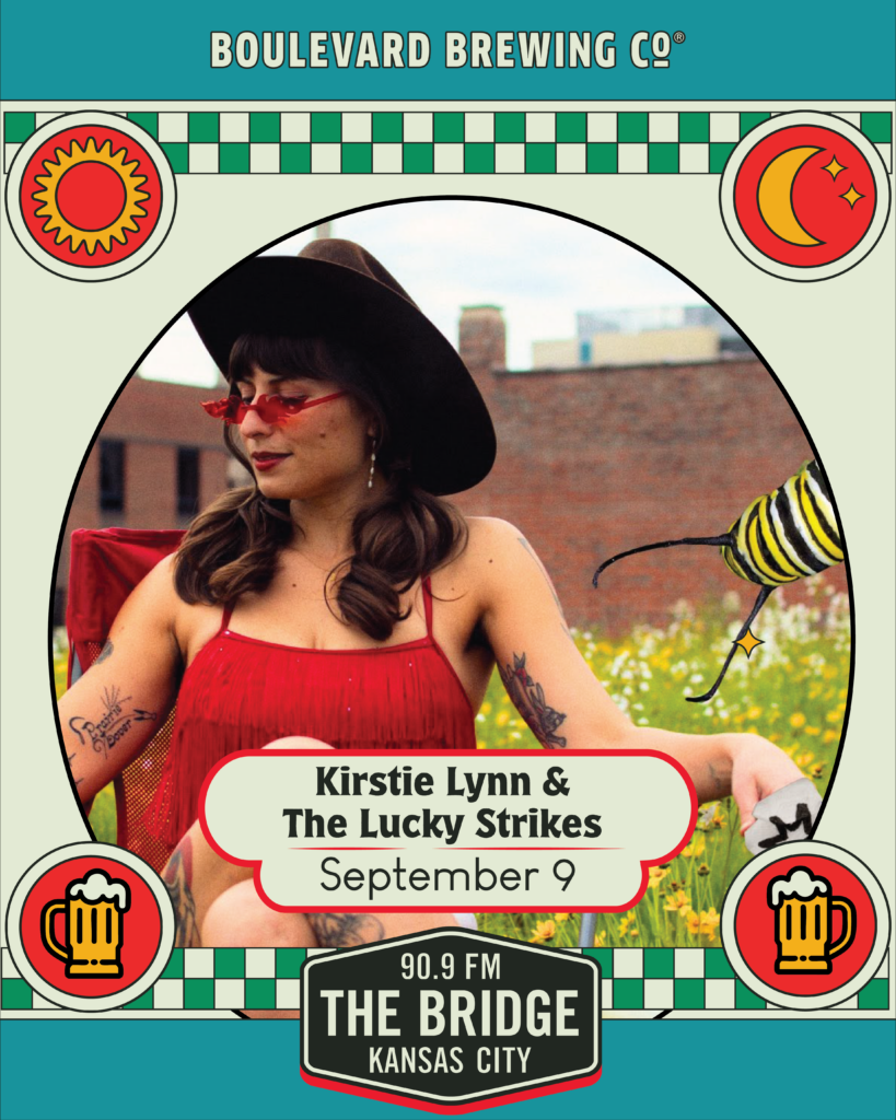 A woman in a red outfit and hat sits outdoors by wildflowers. Text reads: “Kirstie Lynn & The Lucky Strikes, The Early Show, September 9, 90.9 FM The Bridge, Kansas City. Boulevard Brewing Co.” Decorative border elements are included.