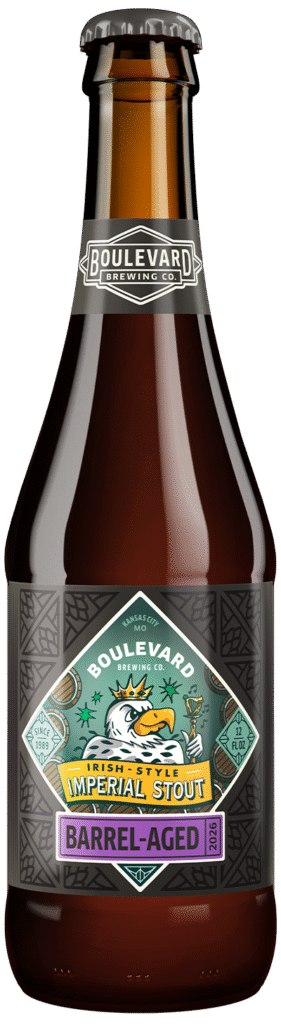 A brown beer bottle with a Boulevard Brewing Co. label, featuring a tiger illustration and text reading “Barrel-Aged Imperial Stout.” The label highlights that the beer is barrel-aged and contains 12 fluid ounces.