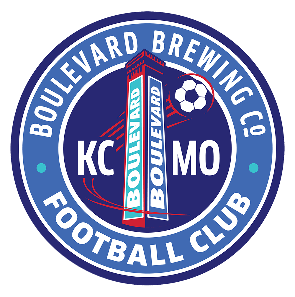 Circular logo for Boulevard Brewing Co. Football Club, featuring a central tower with "Boulevard" text, a soccer ball, and the letters "KC MO" on a dark blue background with light blue and white accents.